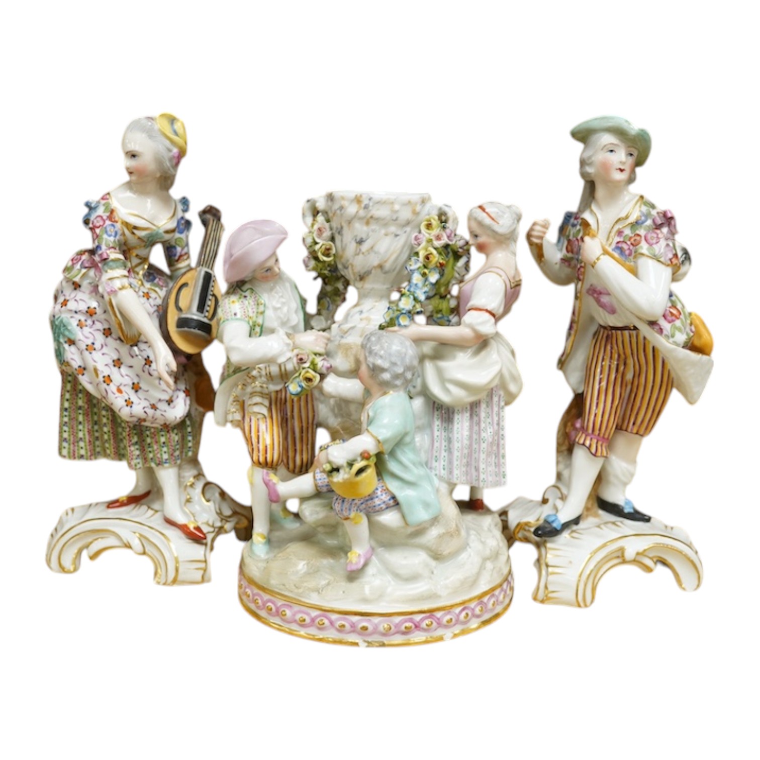 A 19th century Jacob Petit urn group and two similar porcelain figures of musicians, each signed to the bases, largest 20cm high (3). Condition - fair